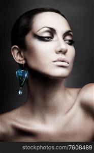 portrait of brunette woman with diamond earring