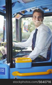 Portrait Of Bus Driver Behind Wheel