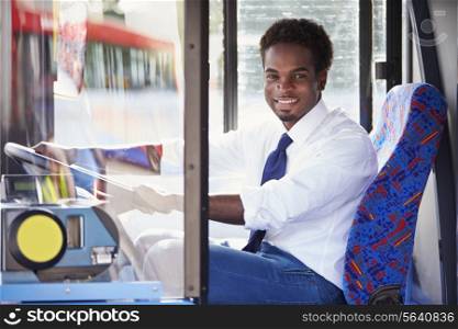 Portrait Of Bus Driver Behind Wheel