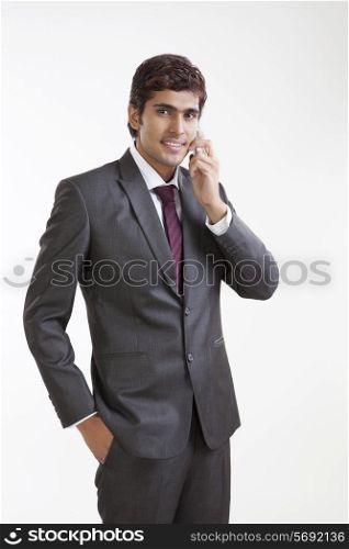 Portrait of business executive talking on a mobile phone