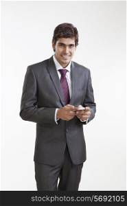 Portrait of business executive with a mobile phone