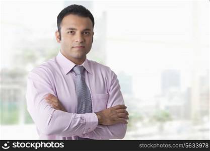 Portrait of business executive with arms folded