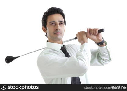 Portrait of business executive with golf club