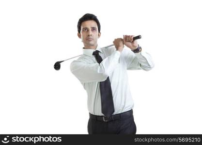 Portrait of business executive with golf club