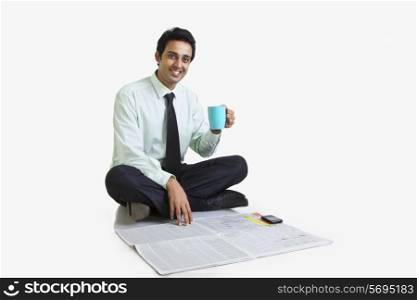 Portrait of business executive with mug of tea