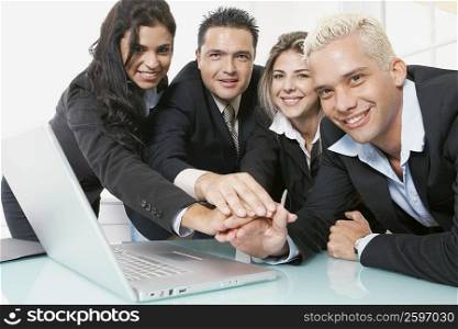 Portrait of business executives with their hands together
