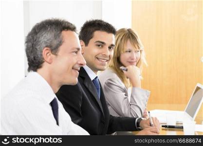 Portrait of business man among colleagues in meeting