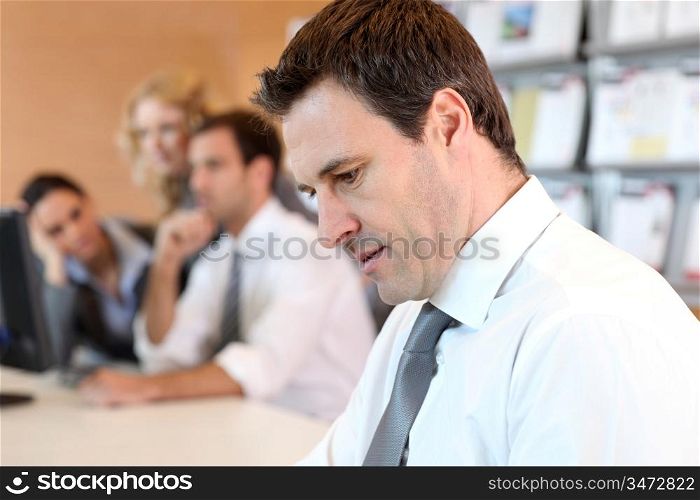 Portrait of business manager using electronic tablet