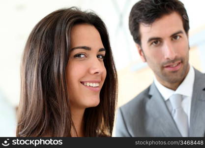 Portrait of business people standing in hall