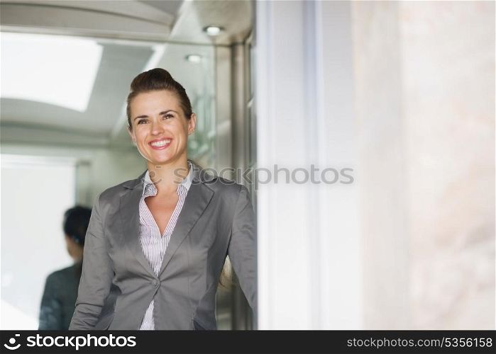 Portrait of business woman in elevator