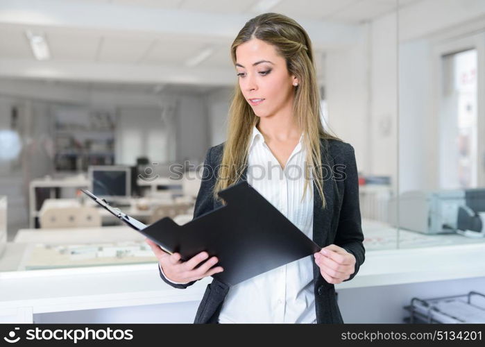 Portrait of business woman in modern glass interior