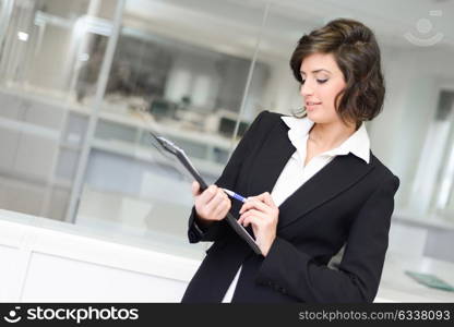 Portrait of business woman in modern glass interior