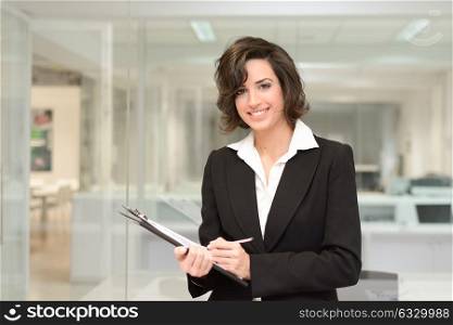 Portrait of business woman in modern office interior