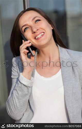 Portrait of business woman on cellphone