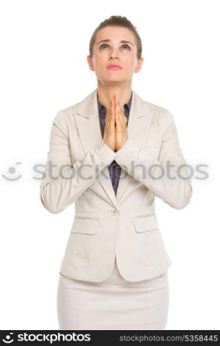 Portrait of business woman praying