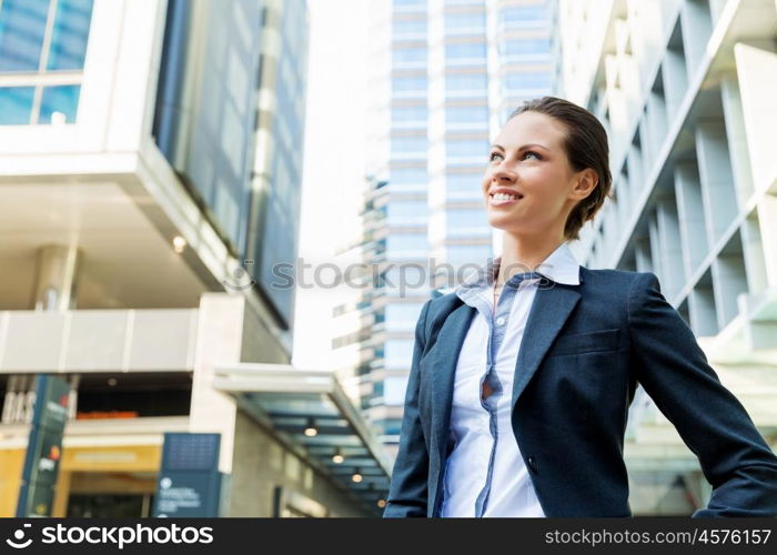 Portrait of business woman smiling outdoor. Portrait of young business woman outdoors