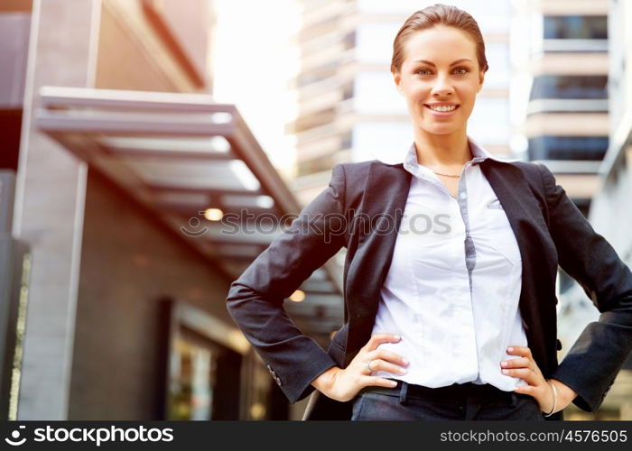 Portrait of business woman smiling outdoor. Portrait of young business woman outdoors