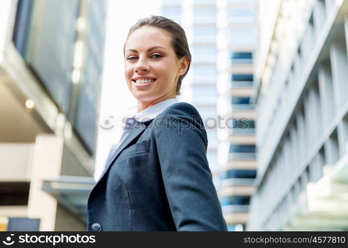 Portrait of business woman smiling outdoor. Portrait of young business woman outdoors