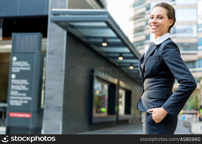 Portrait of business woman smiling outdoor. Portrait of young business woman outdoors