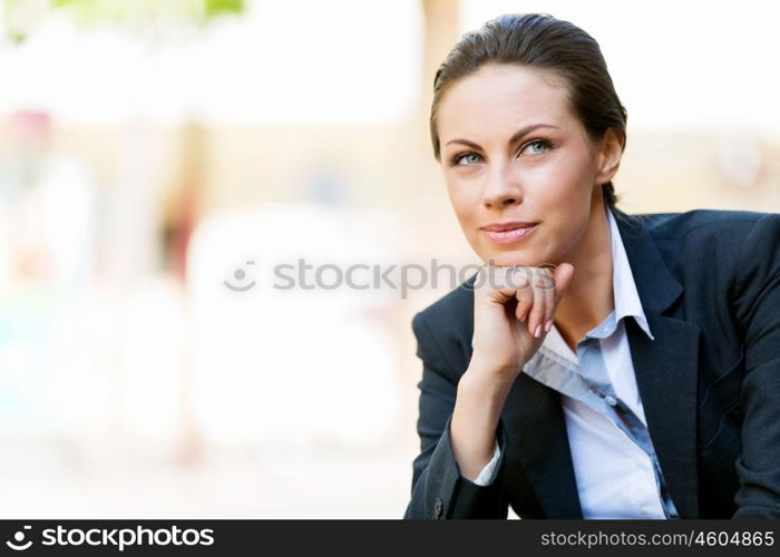 Portrait of business woman smiling outdoor. Portrait of young business woman outdoors