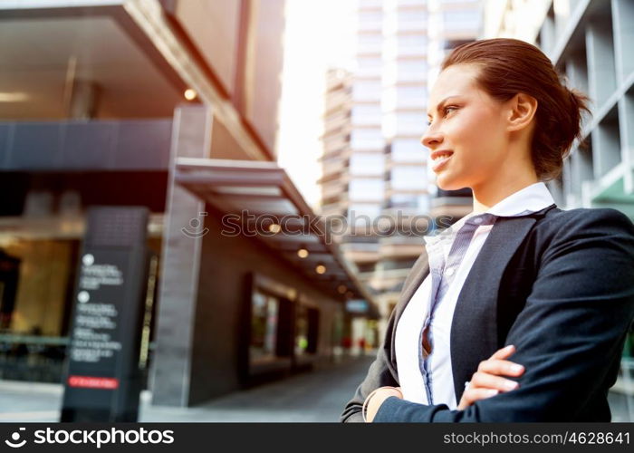 Portrait of business woman smiling outdoor. Portrait of young business woman outdoors