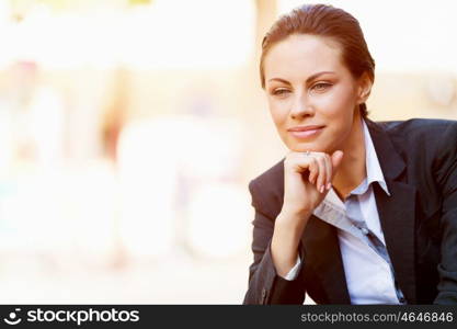 Portrait of business woman smiling outdoor. Portrait of young business woman outdoors