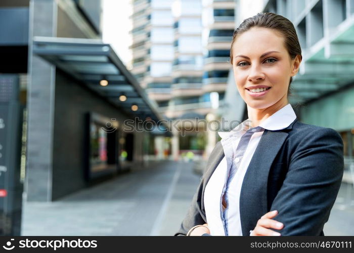 Portrait of business woman smiling outdoor. Portrait of young business woman outdoors