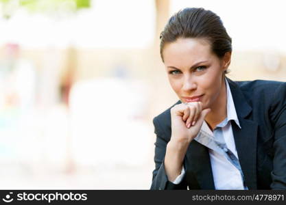 Portrait of business woman smiling outdoor. Portrait of young business woman outdoors