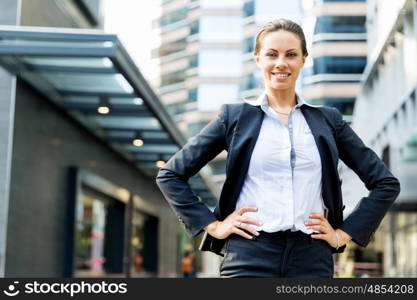 Portrait of business woman smiling outdoor. Portrait of young business woman outdoors