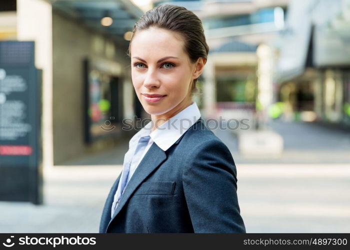 Portrait of business woman smiling outdoor. Portrait of young business woman outdoors