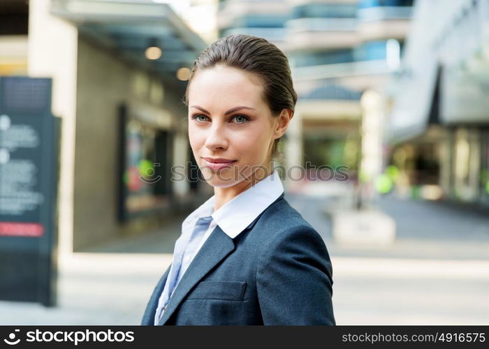 Portrait of business woman smiling outdoor. Portrait of young business woman outdoors