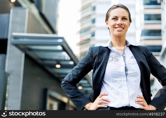 Portrait of business woman smiling outdoor. Portrait of young business woman outdoors