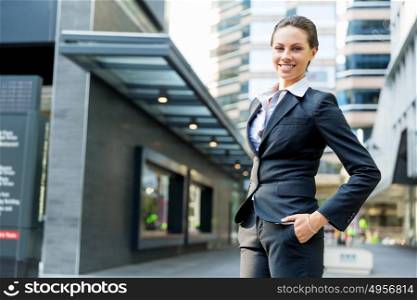 Portrait of business woman smiling outdoor. Portrait of young business woman outdoors