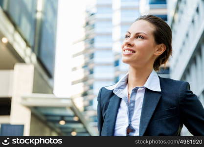 Portrait of business woman smiling outdoor. Portrait of young business woman outdoors