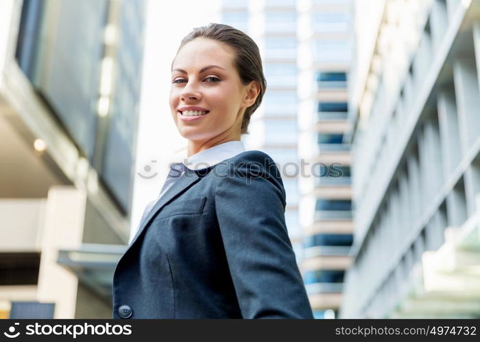 Portrait of business woman smiling outdoor. Portrait of young business woman outdoors