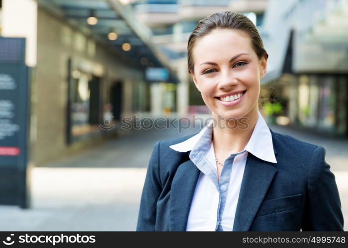 Portrait of business woman smiling outdoor. Portrait of young business woman outdoors