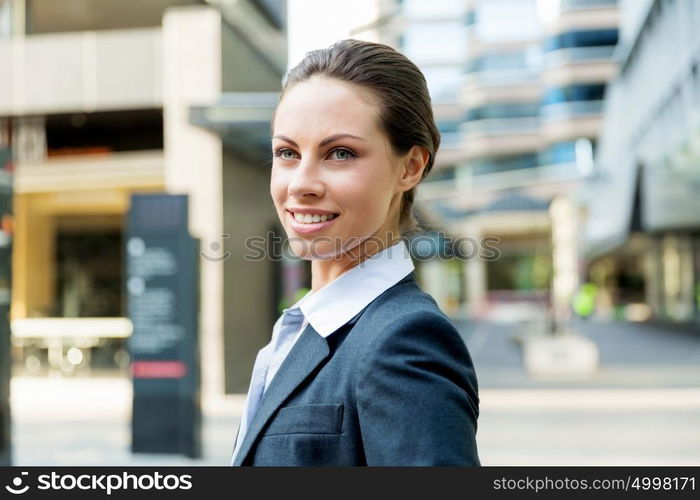 Portrait of business woman smiling outdoor. Portrait of young business woman outdoors