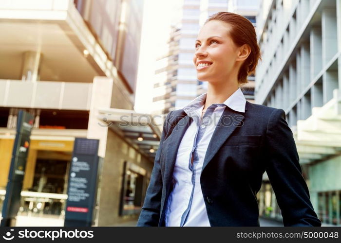 Portrait of business woman smiling outdoor. Portrait of young business woman outdoors