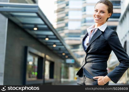 Portrait of business woman smiling outdoor. Portrait of young business woman outdoors