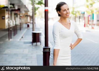 Portrait of business woman smiling outdoor. Portrait of young business woman outdoors