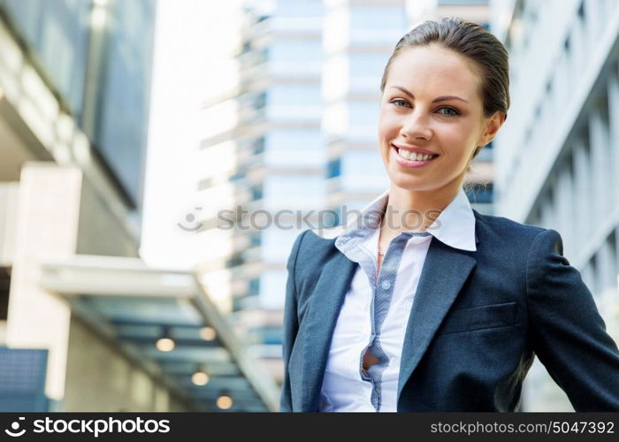 Portrait of business woman smiling outdoor. Portrait of young business woman outdoors