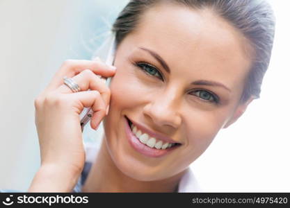 Portrait of business woman smiling outdoor. Portrait of young business woman with mobile phone outdoors