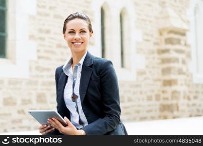 Portrait of business woman smiling outdoor. Portrait of young business woman with notebook outdoors