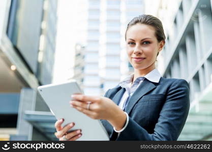 Portrait of business woman smiling outdoor. Portrait of young business woman with notepad outdoors