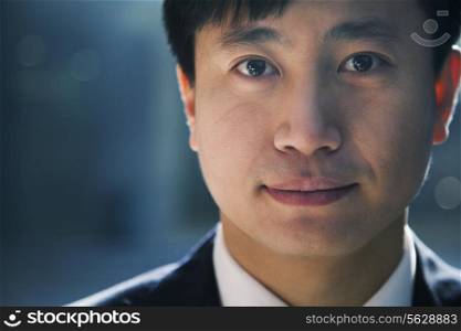 Portrait of businessman in a parking garage, close-up
