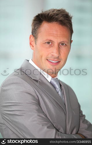 Portrait of businessman in grey suit