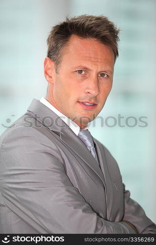 Portrait of businessman in grey suit