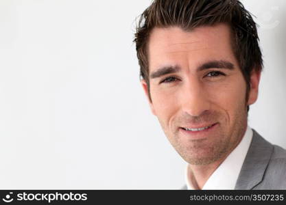 Portrait of businessman on grey background