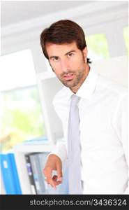 Portrait of businessman standing in office