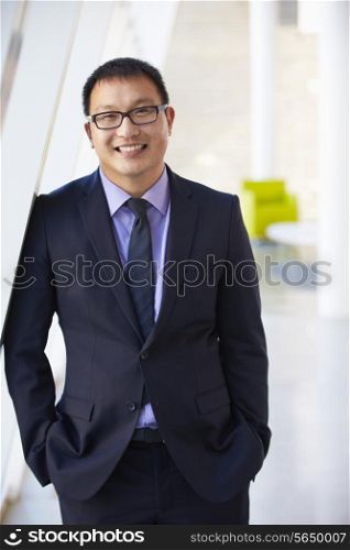 Portrait Of Businessman Standing Modern Office Reception
